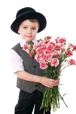 Boy Holds A Bouquet Of Carnations