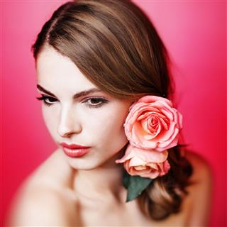 Girl With Pink Roses In Hair