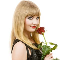 Gorgeous Woman Holds Rose Flower