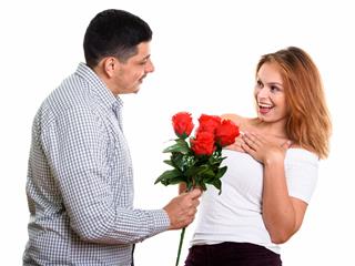 Man Giving Red Roses To Woman