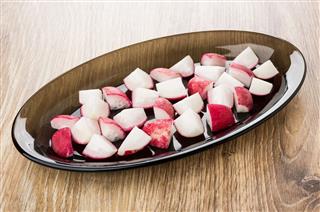 Slices Of Radishes In Brown Dish