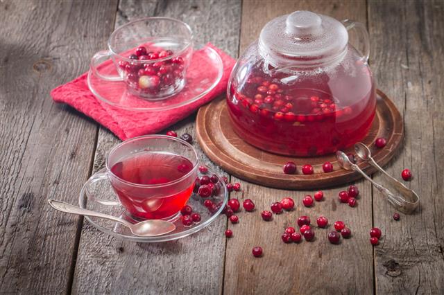 Cranberry Tea In A Glass Cup And Teapot