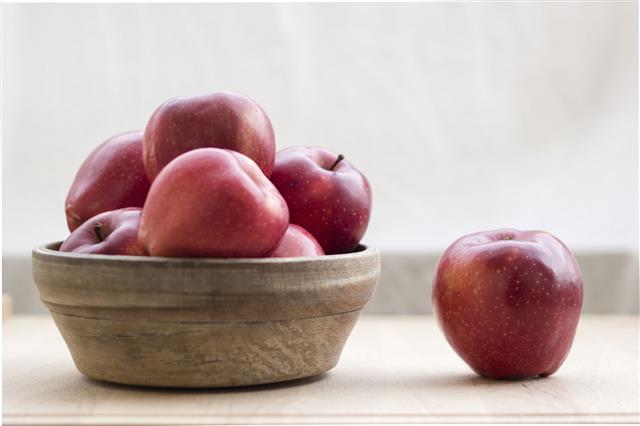 Red Apples In Wooden Bowl