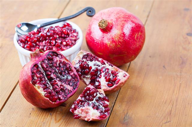 Pomegranate Fruit And Pips In Bowl
