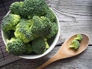 Fresh Broccoli in a bowl on rustic background