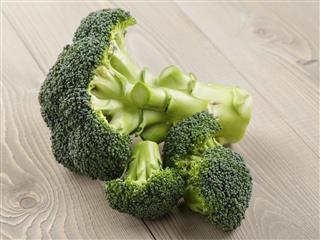 Fresh broccoli on wood board