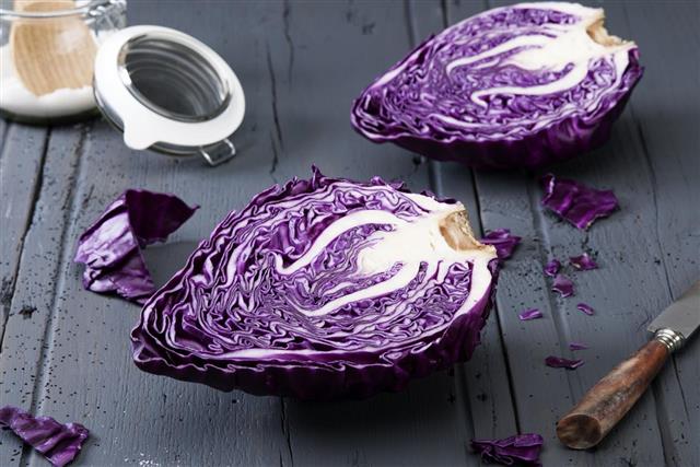 Sliced red cabbage on old wooden table