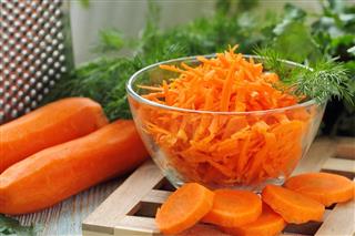 Salad with fresh carrot and greens