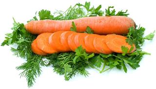 Whole carrot and few slices over some dill & parsley
