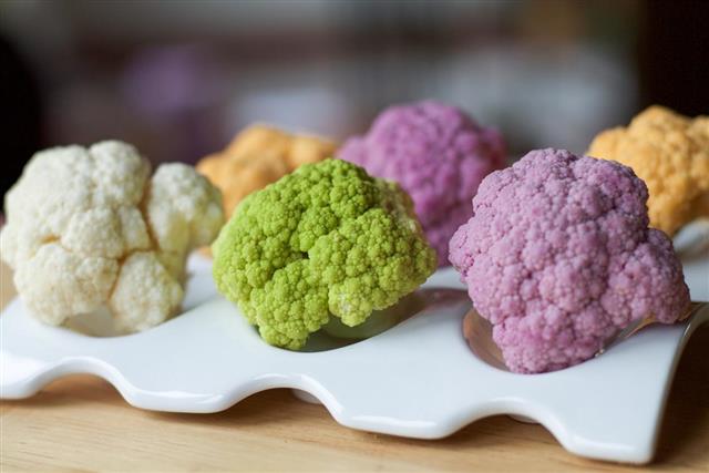 Variety of cauliflowers in different colors on a plate