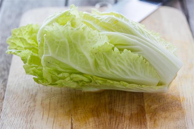 Lettuce on kitchen board