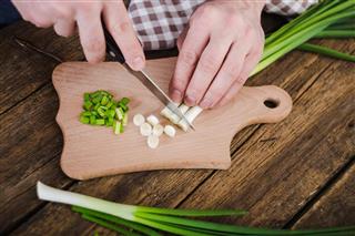 Green onions on wooden background. Cooking