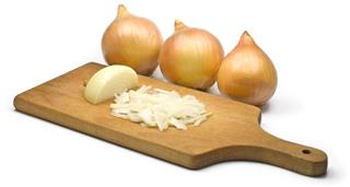 Onions with wooden board