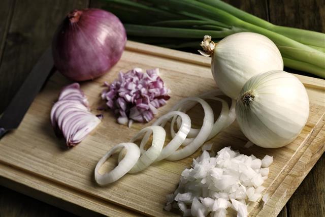 Group of red, green and white onions ready for cooking