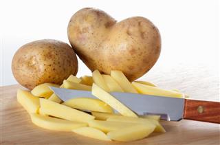 Potato on cutting board