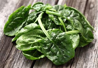 Spinach On Wooden Background
