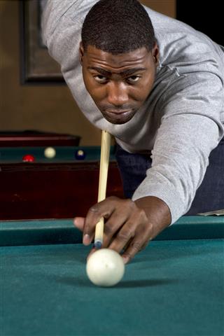 Handsome Black Man Playing Billiards