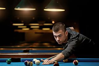 Young Man Playing Pool