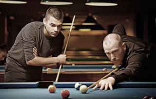 Male Friends Playing Pool