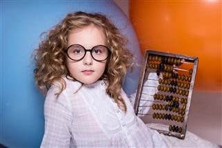 Girl With Wooden Abacus