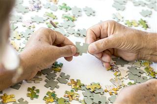 Senior Couple Playing Puzzle