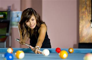 Asian Woman Playing Pool