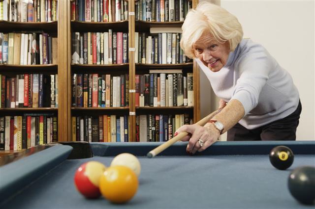 Elderly Woman Shooting Pool