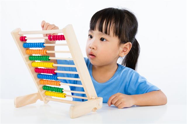 Chinese Girl Playing Colorful Abacus
