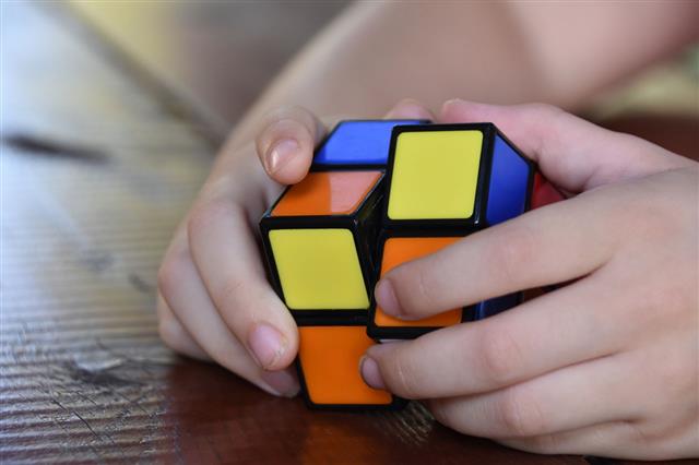 Hands Playing A Cube Game