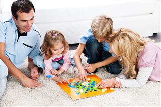 Parents Playing Board Game