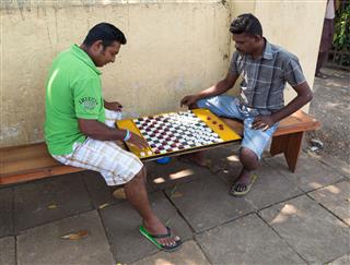 Men Play Checkers On Street