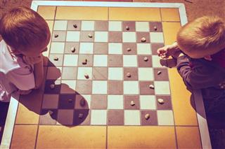 Children Playing Checkers Outdoor