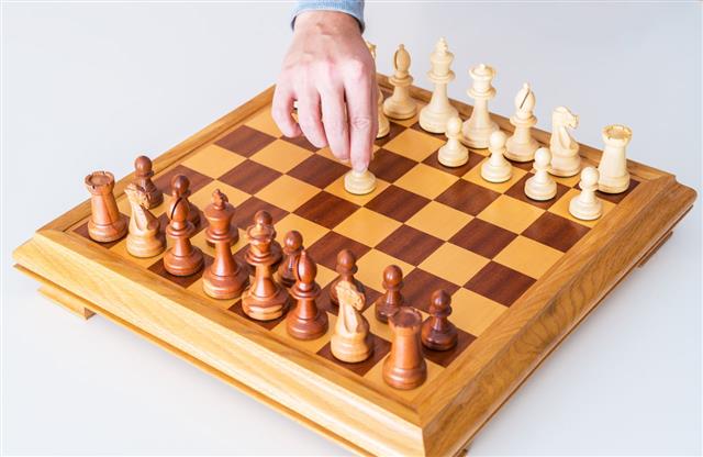 Hand With Pawn Makes First Move