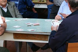 Elderly People Playing Cards