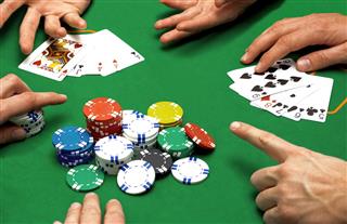 Close Up Of People Playing Poker