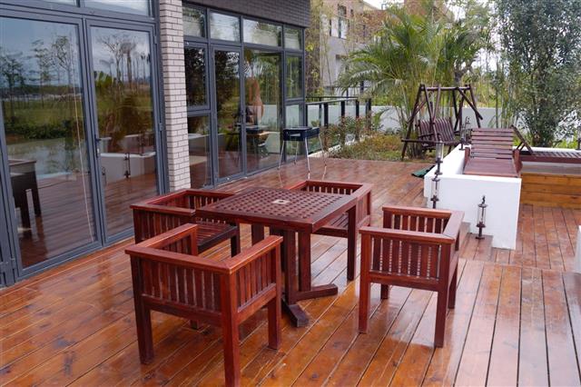 Patio With Wooden Table And Chairs