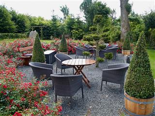 Landscaped Backyard With Beautiful Garden Furniture