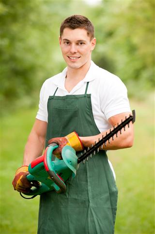 Gardener With Hedge Trimmer