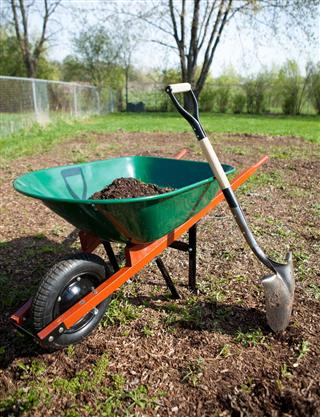 Wheelbarrow with Dirt and Shovel