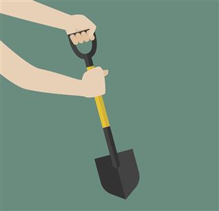 Hand hold shovel prepare to dig