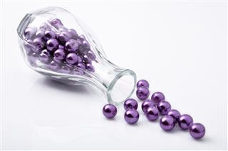 Purple Bead In Glass Bottle