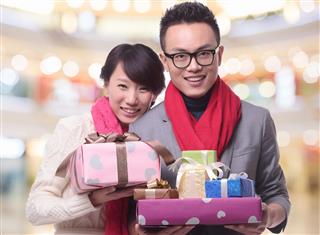 couple holding gifts