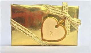 Gold gift box with heart label card