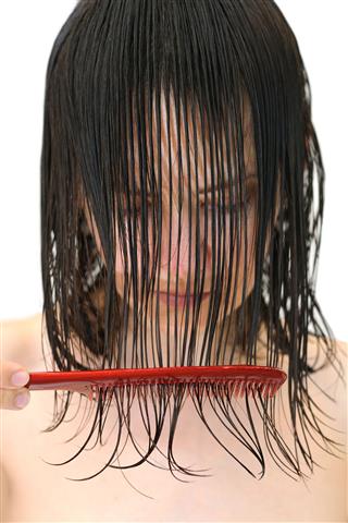Woman Combing Wet Hair
