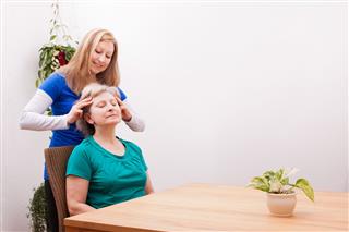 Senior Woman Getting Scalp Massage