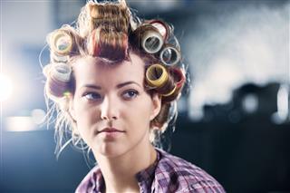 Woman With Curlers In Her Hair