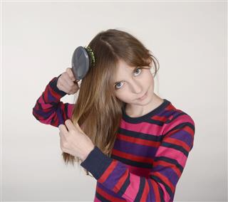 Girl Combing Hair