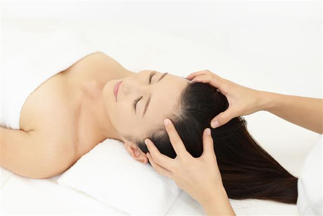 Woman Having Head Massage