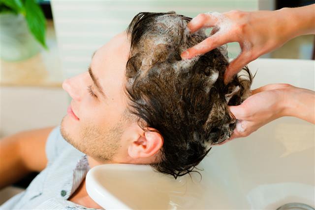 Man Washing His Hair At Salon