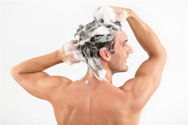 Man Washing Hair With Shampoo